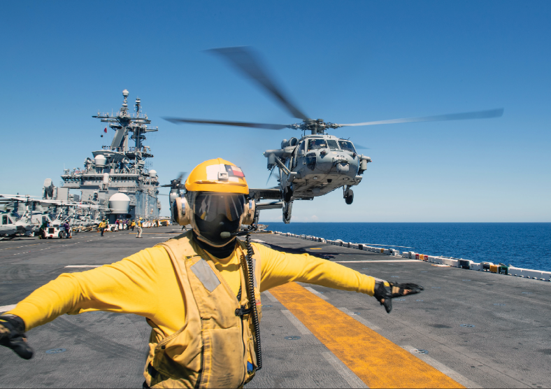 MH-60S Seahawk assigned to “Wildcards” of Helicopter Sea Combat Squadron 23 departs flight deck aboard amphibious assault ship USS Boxerwhile ship transits Tsushima Strait, September 18, 2024 (U.S. Navy/Normand Basque)
